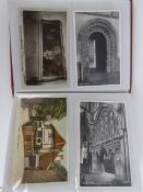 An album containing an extraordinary collection of vintage postcards and photo cards of the
