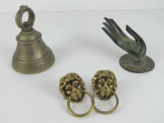 A wall mounted burnished copper key holder in the form of an outstretched hand,