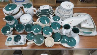 An extensive Denby stoneware dinner and tea service in Greenwheat pattern including; saucepans,