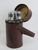 A trio of triangular spirit flasks within pigskin leather carry case.