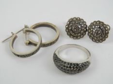 A pair of silver marcasite hoop earrings stamped 925,