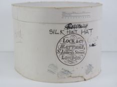 An oval cardboard Lock & Co top hat box having fitted interior (contents deficient).