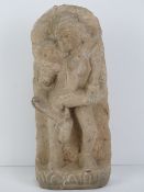 A hand carved stone figurine of Indo Asian erotic influence showing the union between man and woman,