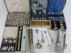 A quantity of assorted silver plated cutlery inc various box sets.