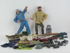 Two original Action Man dolls c1970's together with a selection of clothing, uniform, boots,