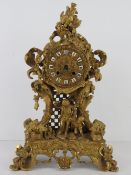 A superb gilt brass 19th century Continental mantle clock by E Pannard having hand painted ceramic