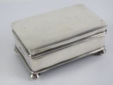 A rare HM silver tabletop playing cards box made by A&J Zimmerman Ltd, hallmarked Birmingham 1946.