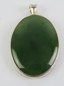 A large green agate pendant in setting stamped 925, 5cm inc bale.