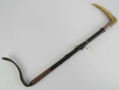 A HM silver collared and malacca horn handles riding crop with short leather tail, 67cm in length,