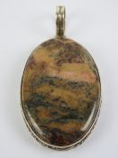A large hardstone pendant in setting stamped 925, 7cm inc bale.