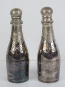 A pair of miniature silver plated champagne bottles by Parks of London,
