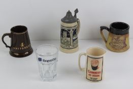 A 'Guinness As Usual' jug having official merchandise stamp to base and standing 12cm high.