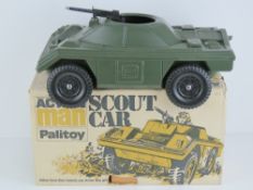 An original Action Palitoy Scout car in original box, with centre mounted machine gun,