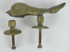 A heavy cast brass door knocker in two sections, in the form of a mythological sea creature,