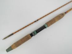 A vintage Allcocks two piece split cane spinning fishing rod 'Lightcaster', 8ft long.