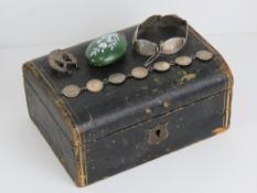 A vintage leatherette jewellery box having purple fabric lining and containing;