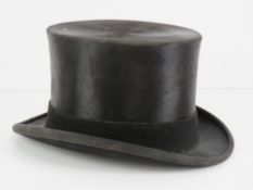 A Moss Bros silk top hat size 7.25.
