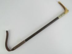 A horn handled and malacca leather tailed riding crop with nickel collar engraved JML,