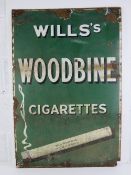 A vintage enamelled tinplate advertising sign 'Wills's Woodbine Cigarettes', measuring 92 x 61cm.