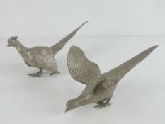 A pair of silver plated table centrepiece fighting pheasant decorations, each approx 23cm in length.