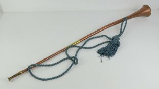 A copper and brass coaching horn, with carry strap, 86cm in length.