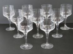 A set of nine wine glasses each standing 15.5cm high.