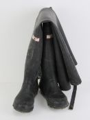 A pair of black rubber coarse fishing individual waders with belt straps, size 5.