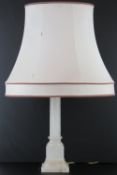 A fine and heavy carved alabaster table lamp base of Ionic form, 44cm high.
