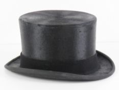 A silk top hat size by S Patey, leather sweatband, size 7.25.