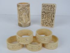 A 19th century carved ivory cylindrical brush pot, 9 x 5cm.