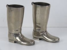 A pair of silver plated 1.5oz tot cups in the form of riding boots.