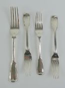 A single HM silver dinner fork with matching salad forks,