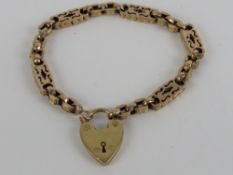 A late Victorian / Edwardian 9ct rose gold bracelet having faceted links and panels having star