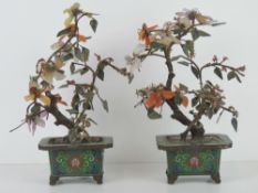 Two cloissone footed planter pots, each having decorative leaves made of amethyst, carnelian,