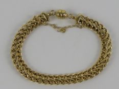 A 9ct gold articulated fancy link chain bracelet having magnetic clasp for easy fastening,