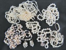 A quantity of assorted pearl necklaces inc one with HM silver clasp.