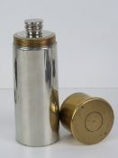A spirit flask in the form of a shotgun cartridge, silver plated, pewter and brass, 15cm high.
