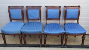 A set of four Victorian mahogany reeded dining chairs, raised over turned and reeded legs.