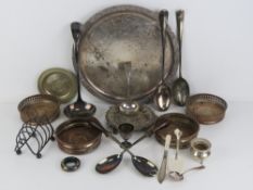A quantity of assorted metalware including; silver plated tray, four wine coasters, toast rack,