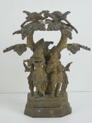 A heavy brass Indo Asian figurine of male playing musical instrument and female in traditional