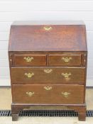 A good short country made 18th century fall front bureau lid lifting to reveal pigeon holes,