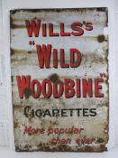 A vintage enamelled tinplate advertising sign 'Wills's Wild Woodbine Cigarettes More Popular than