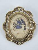 A Victorian pinchbeck swivel brooch having carved bone panel with depiction of a stag upon,