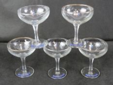 A set of five Babycham champagne saucers.
