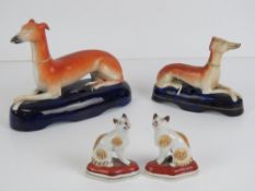 A large Staffordshire pen holder, 16cm in length, together with another smaller, 12cm,