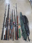 A quantity of assorted contemporary coarse fishing gear including rods, landing nets, umbrella,