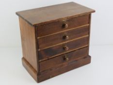 A 20th Century pine specimen cabinet having four lined drawers and measuring 33cm wide, 29.