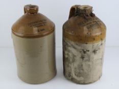 A pair of salt glazed stoneware two gallon jugs having printed marks upon for Duckworth & Co Ltd