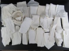 A large quantity of assorted white riding stocks, Moss Bros collars, etc.