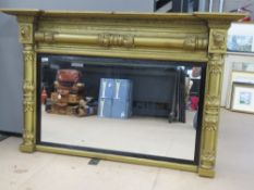An Empire style gilded over-mantle mirror, frame measuring 126.5cm x 81cm.